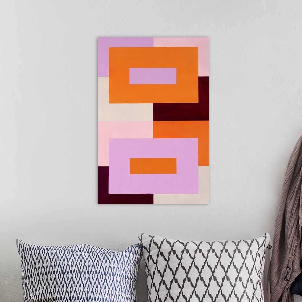 A bohemian room featuring Geometric abstract painting that has a background made out of colorful squares and two large rect...