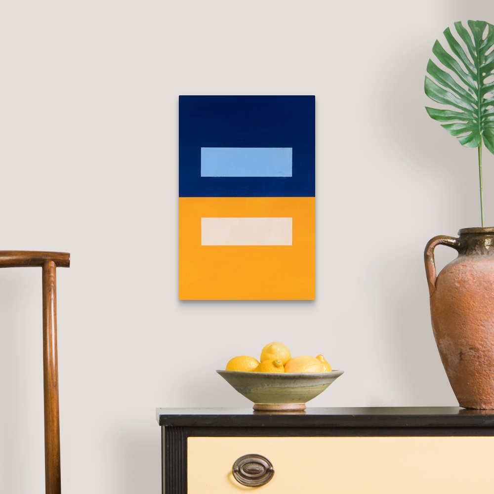 A traditional room featuring Geometric abstract painting that has a background split into two square halves in gold and navy w...