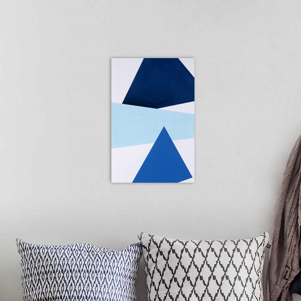 A bohemian room featuring Geometric abstract painting that has a white background with three large triangular shapes stacke...