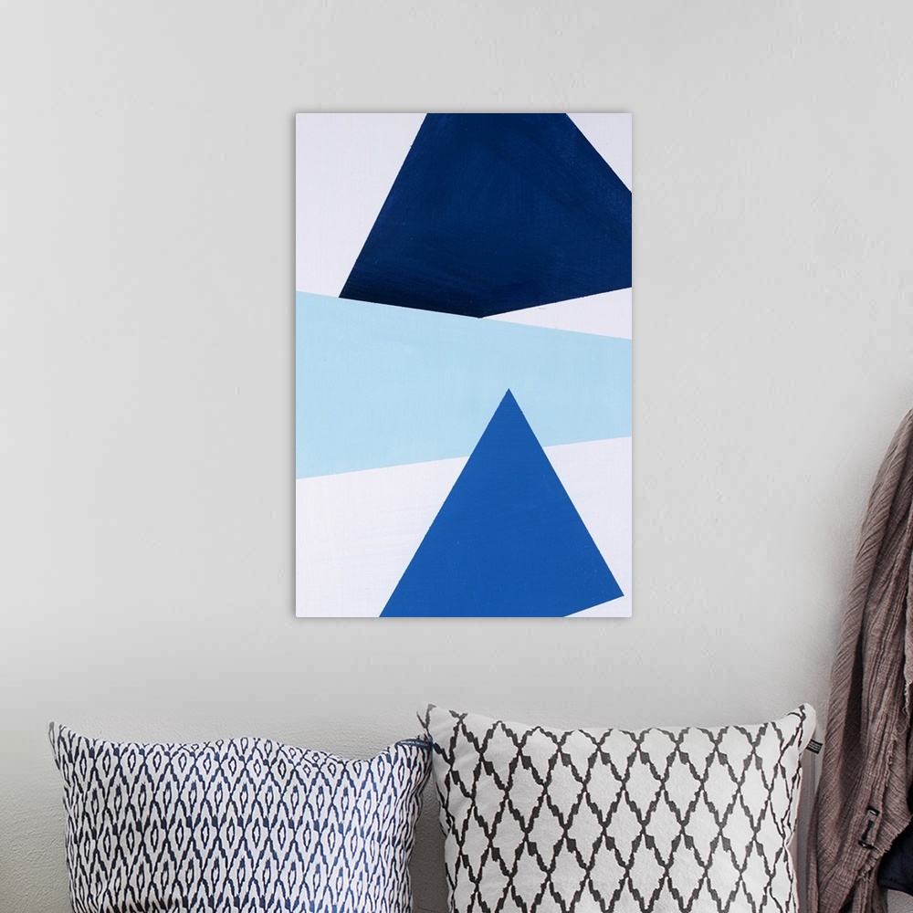 A bohemian room featuring Geometric abstract painting that has a white background with three large triangular shapes stacke...