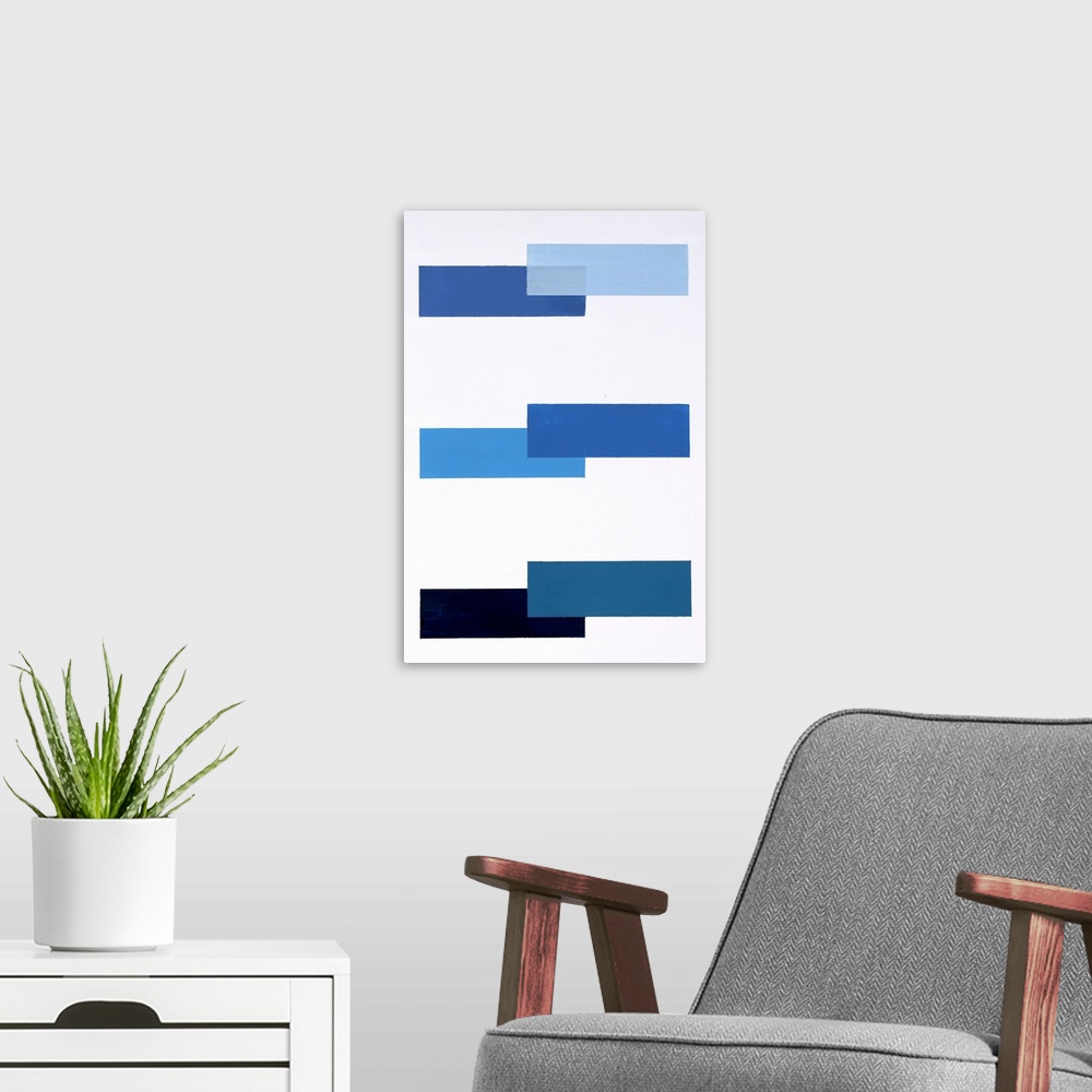 A modern room featuring Geometric abstract painting with a solid white background and various shades of blue rectangles p...