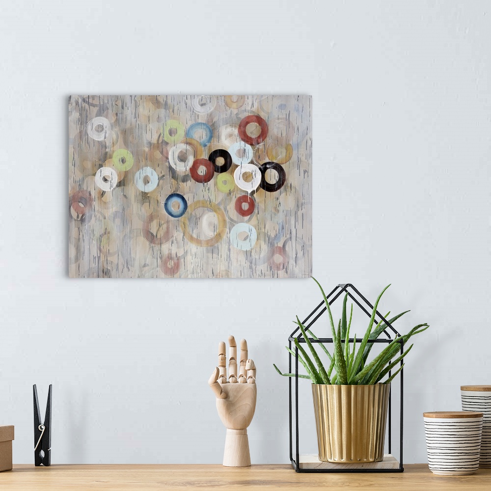 A bohemian room featuring Oversized, contemporary, horizontal painting of a large cluster of circles in various sizes and c...