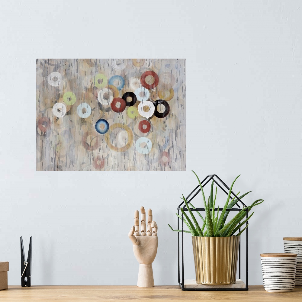 A bohemian room featuring Oversized, contemporary, horizontal painting of a large cluster of circles in various sizes and c...