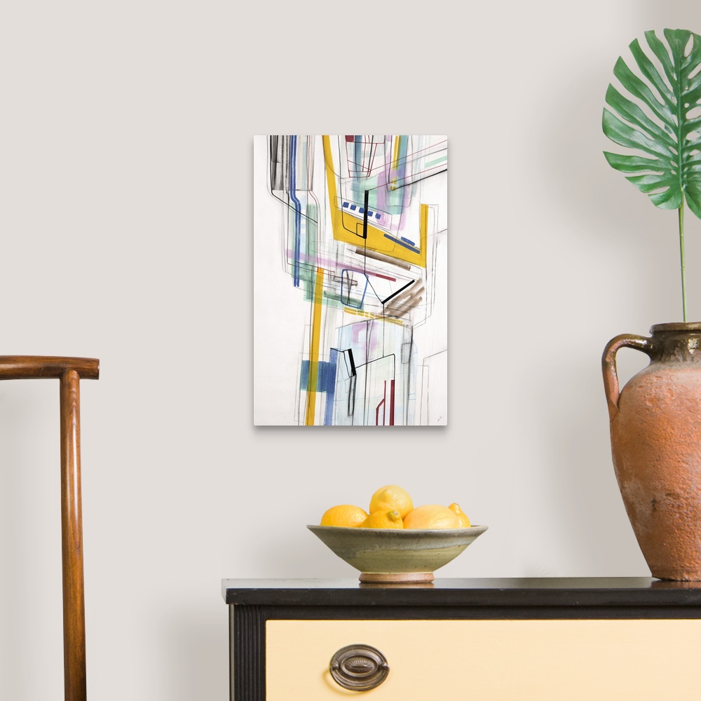 A traditional room featuring Large vertical modern artwork of multi-colored lines interlacing.