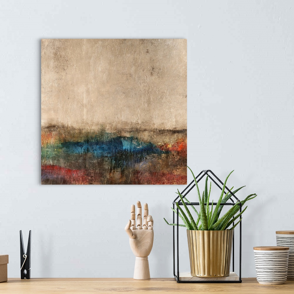 A bohemian room featuring Abstract painting of natural looking colors coming together to form what looks like a landscape.