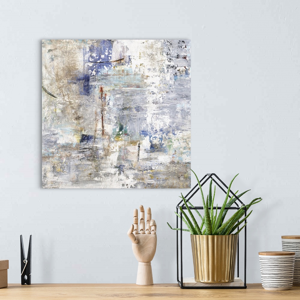 A bohemian room featuring Large square abstract painting with cool tones and busy rough textures.