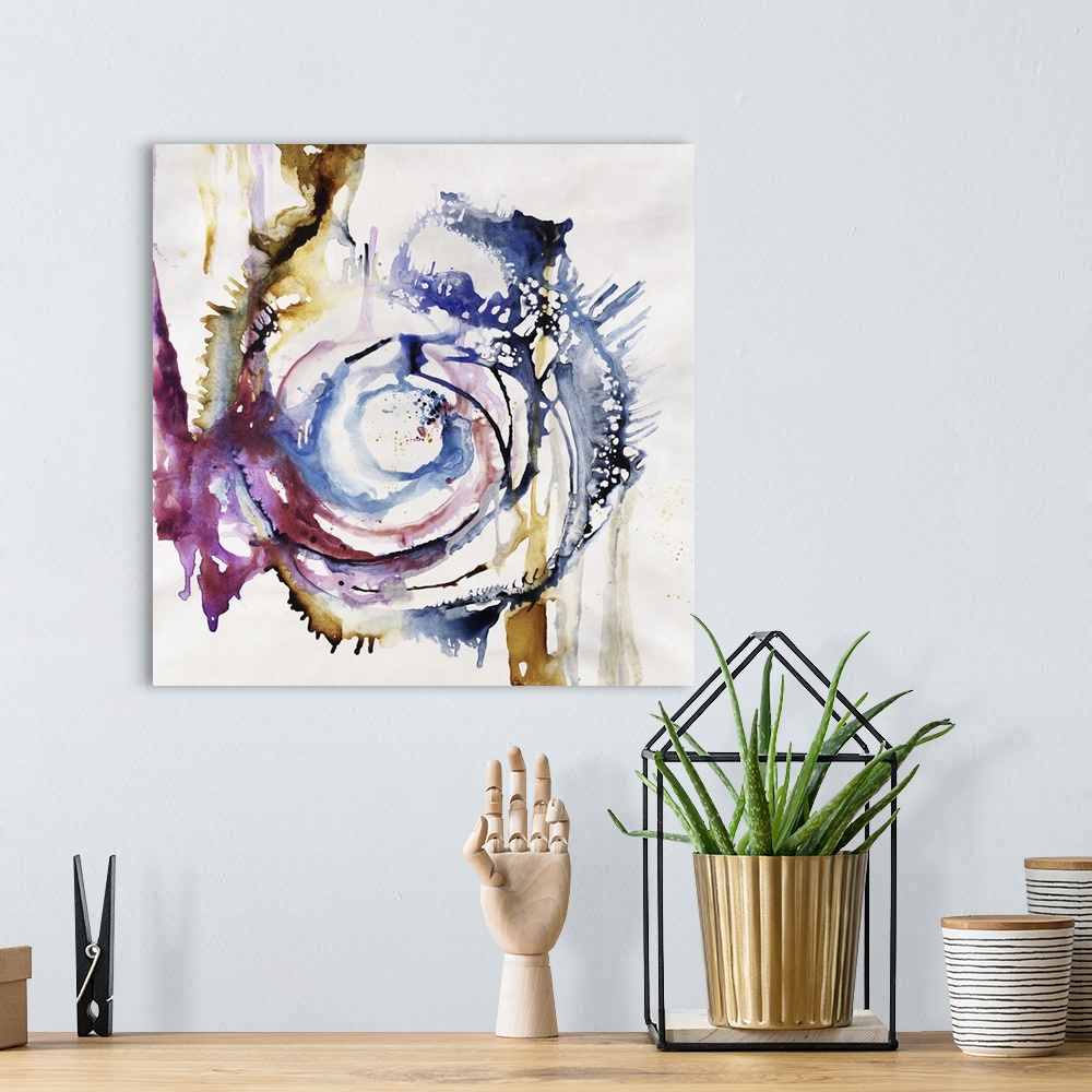 A bohemian room featuring Abstract painting of swirls of vibrant colors of blue, purple and yellow.