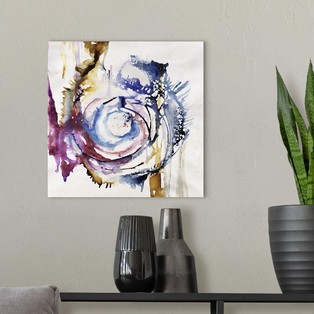 A modern room featuring Abstract painting of swirls of vibrant colors of blue, purple and yellow.