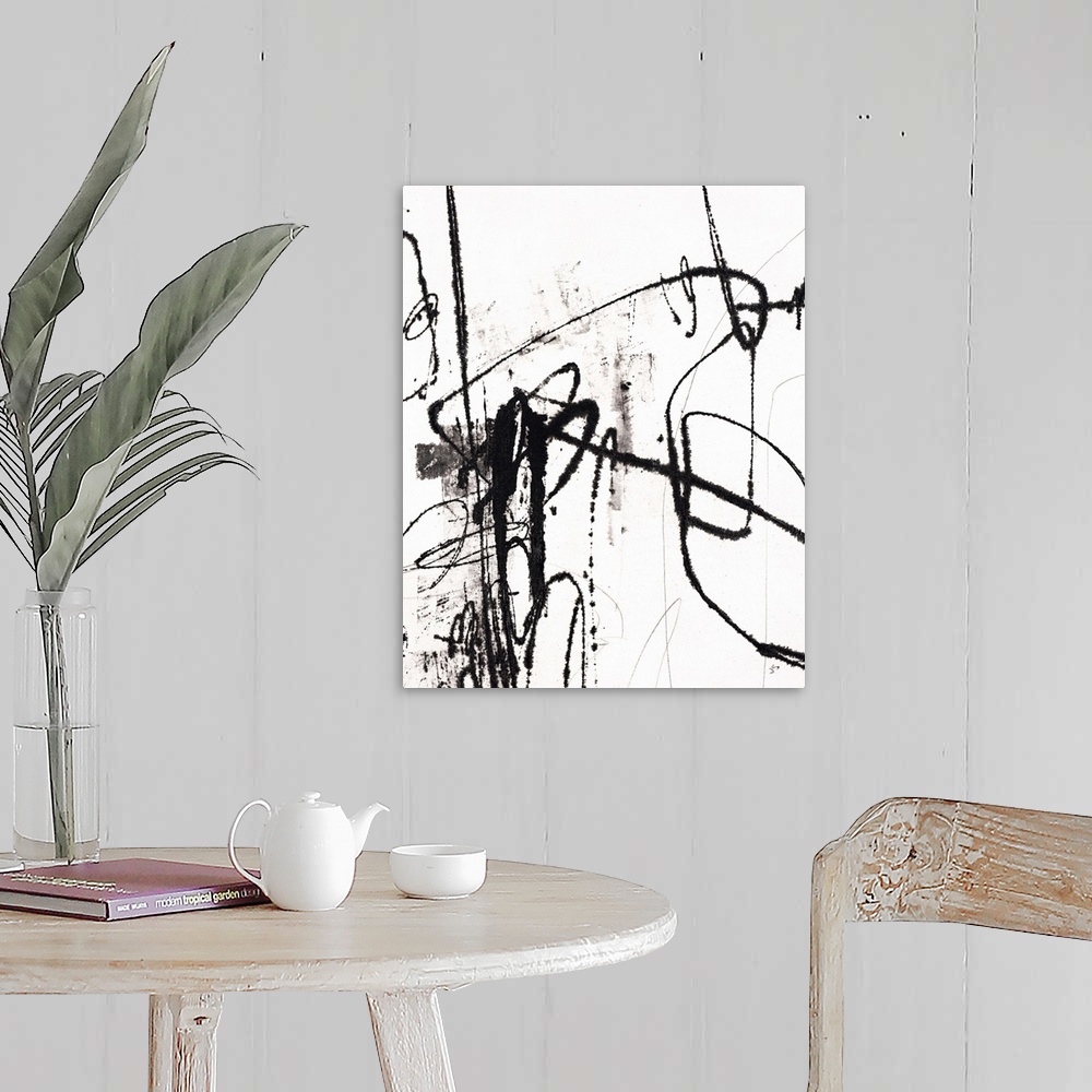 A farmhouse room featuring Contemporary abstract painting using bold black lines against a white surface.