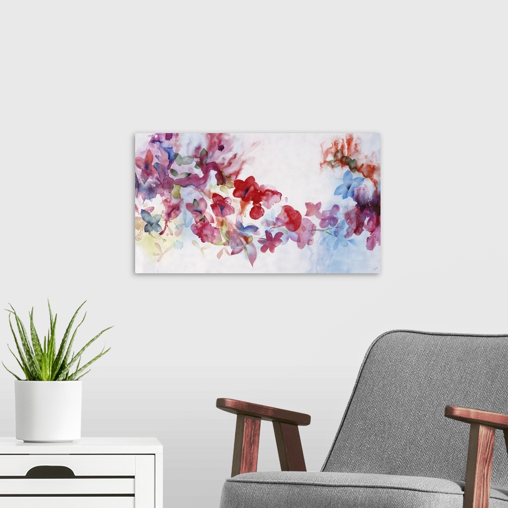 A modern room featuring Large horizontal artwork of colorful flowers of red, pink and blue fading into the white background.