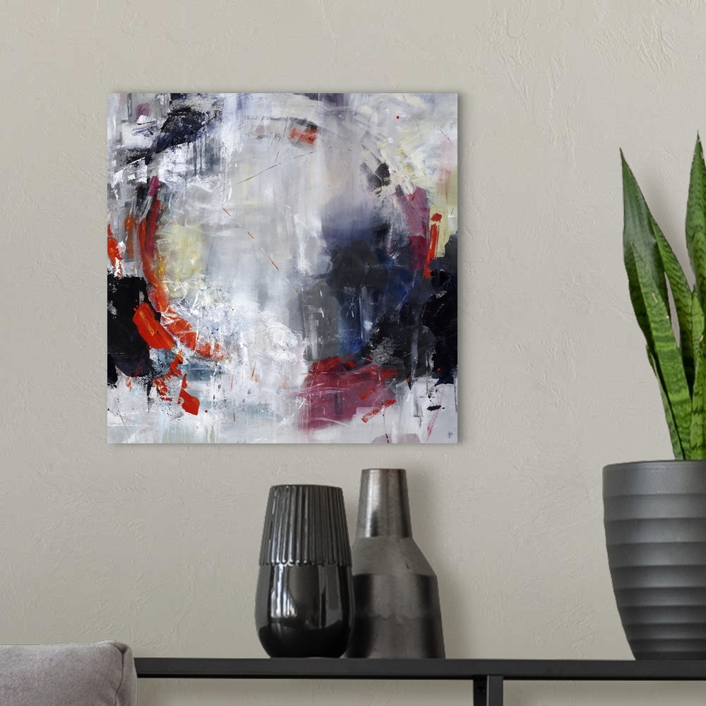 A modern room featuring Abstract painting of textured paint with a hint of a circle shape.