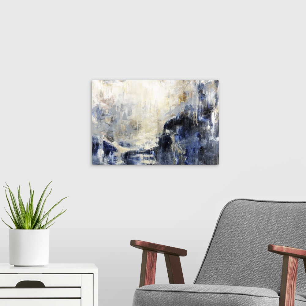 A modern room featuring An abstract painting of cool colors of blue and gold.