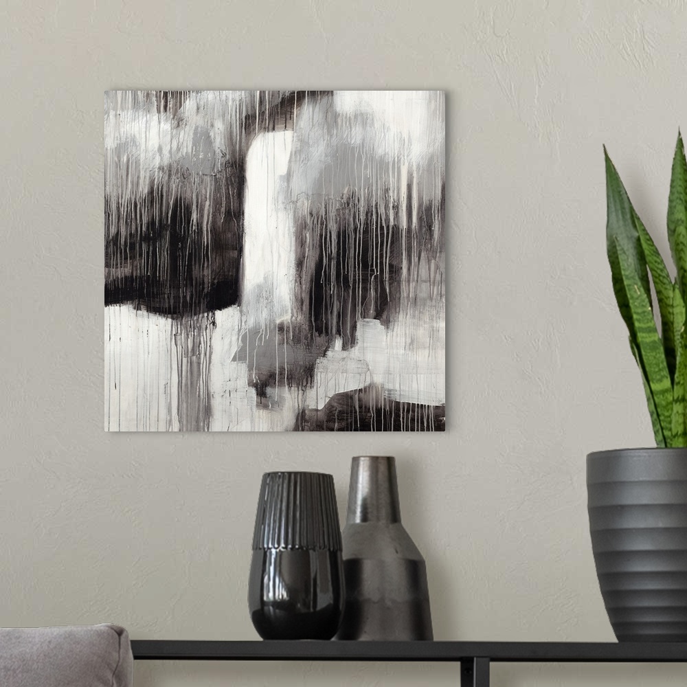 A modern room featuring Contemporary abstract painting in contrasting black and white shades with a dripping paint effect.