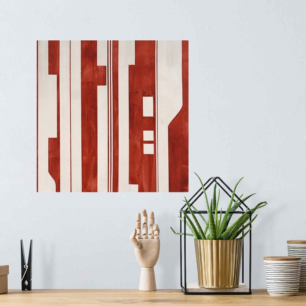 A bohemian room featuring Modern artwork featuring a mixture of red and light colored shapes.