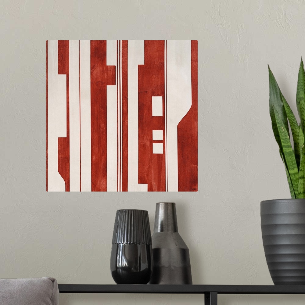 A modern room featuring Modern artwork featuring a mixture of red and light colored shapes.