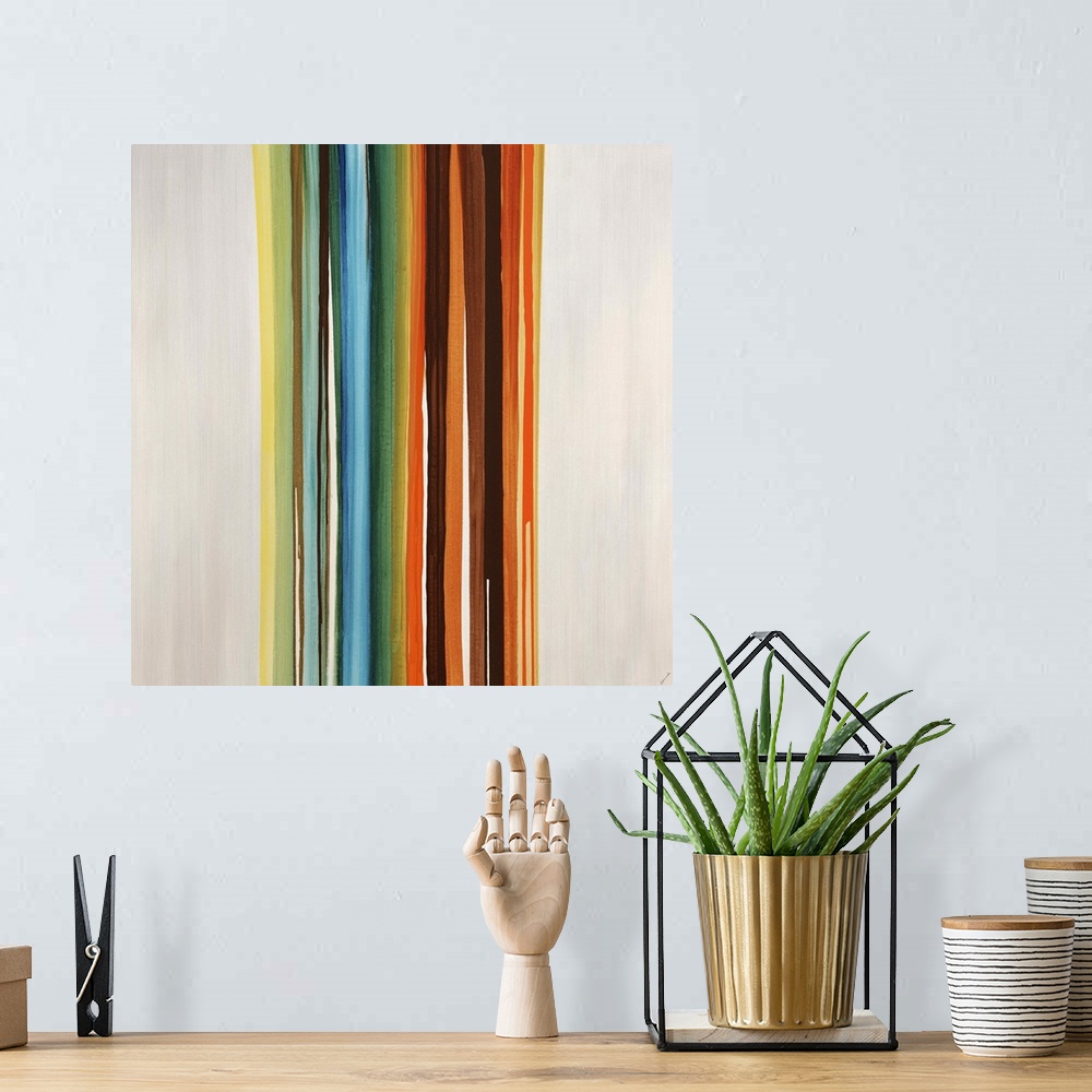A bohemian room featuring Modern art of a cluster of vertical multicolored stripes that are side by side on a light, neutra...