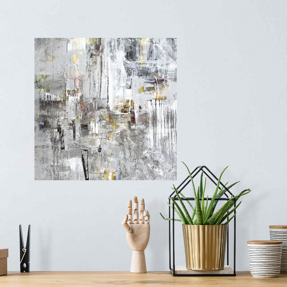 A bohemian room featuring Abstract painting of silver textured brush strokes with yellow accents.