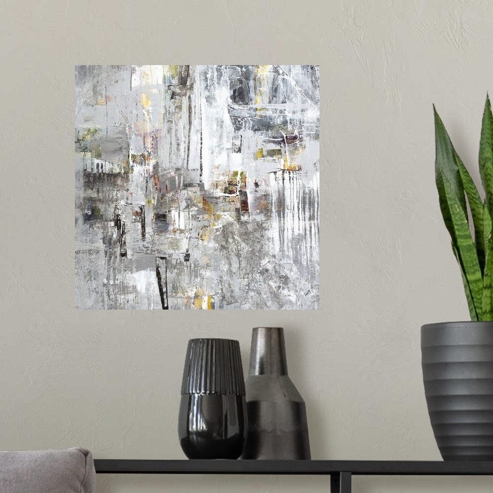 A modern room featuring Abstract painting of silver textured brush strokes with yellow accents.