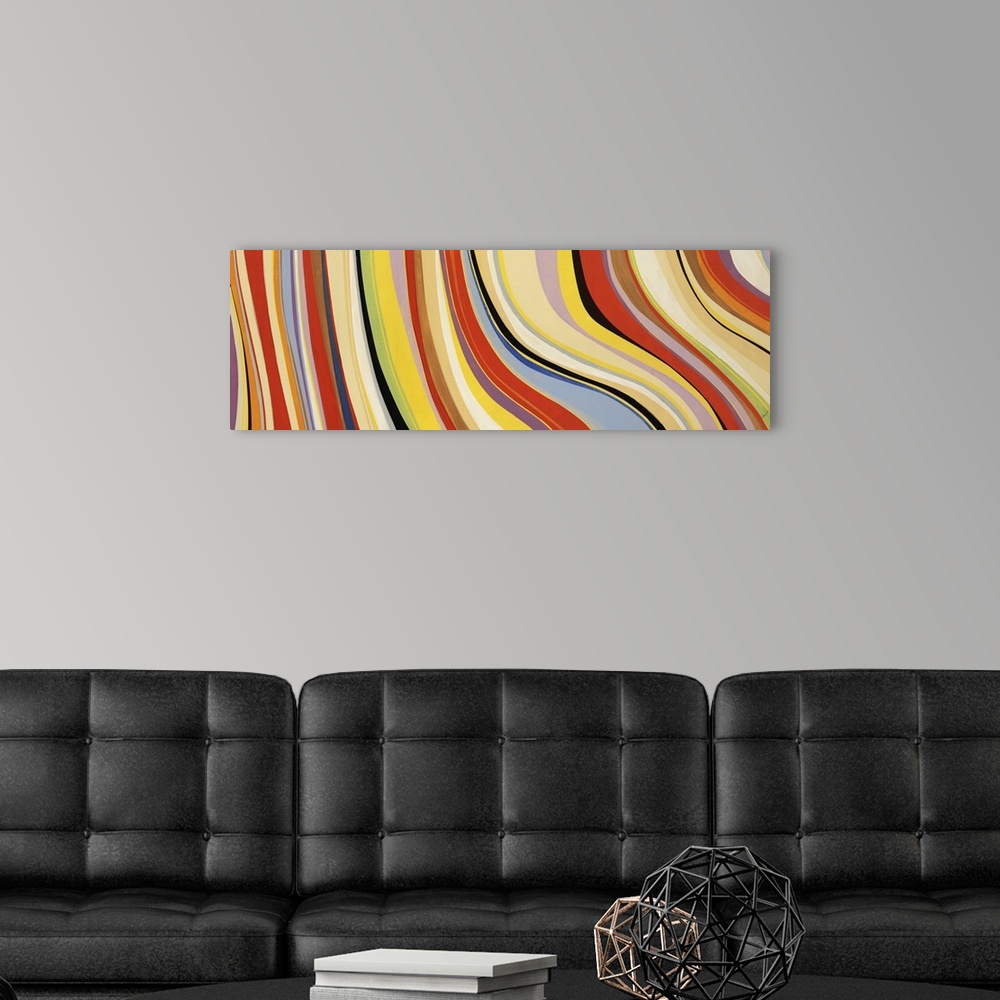 A modern room featuring Oversized contemporary artwork of vertical, waving stripes in a variety of retro colors.