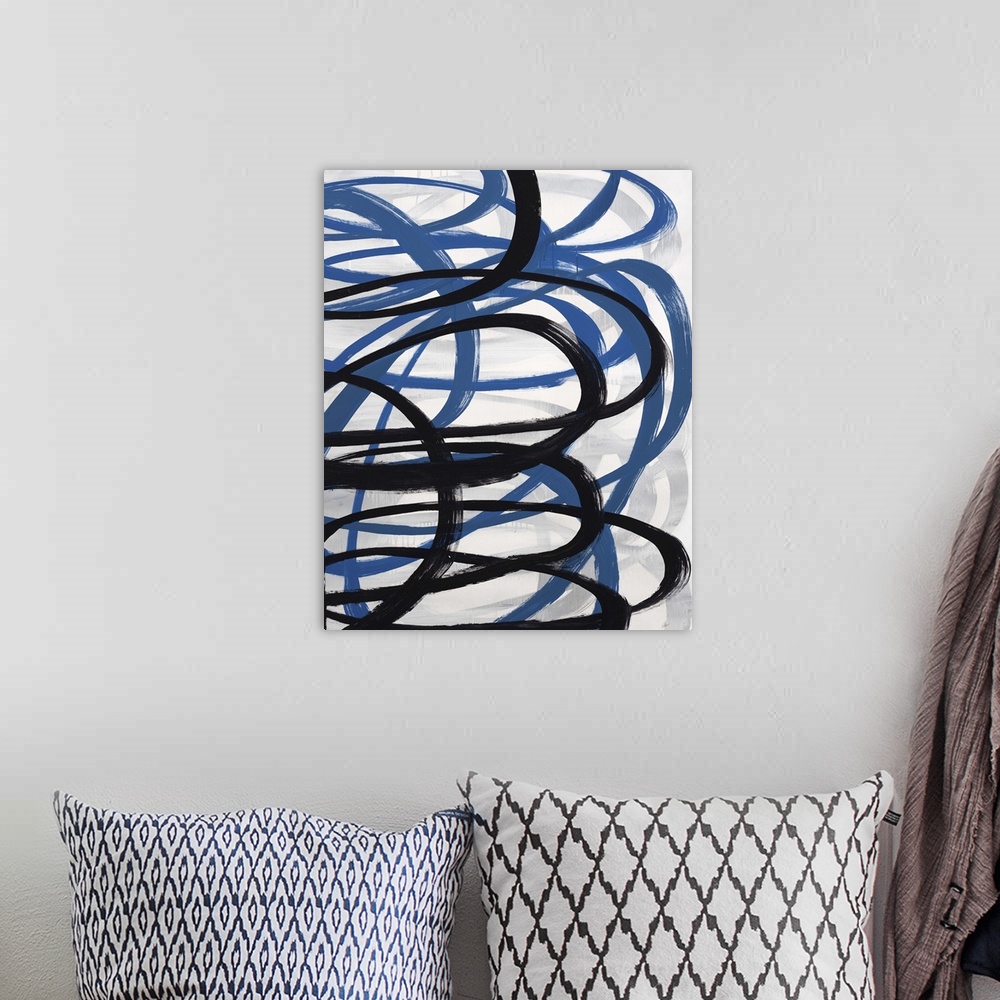 A bohemian room featuring Contemporary abstract painting of a dark blue and black swirling lines against a neutral background.