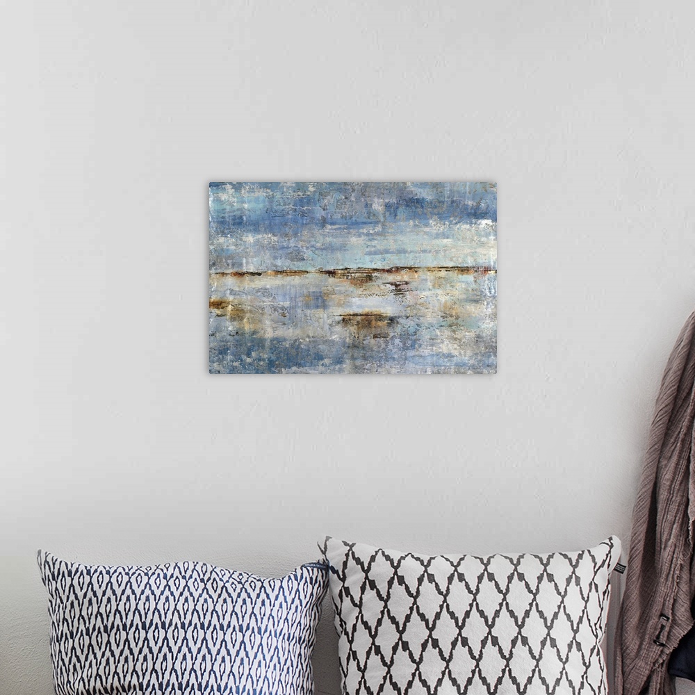 A bohemian room featuring Rough abstract artwork in shades of blue and brown.