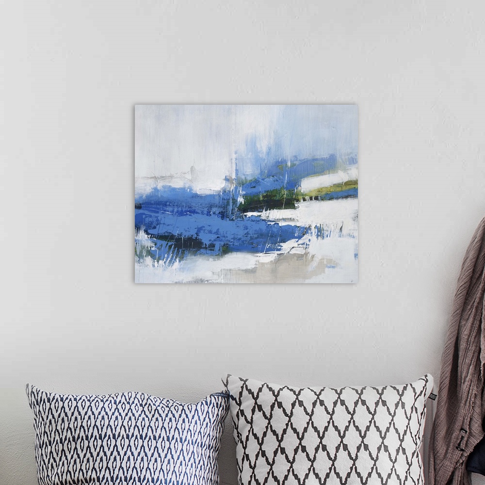 A bohemian room featuring Contemporary abstract artwork in deep blue and pale white tones.