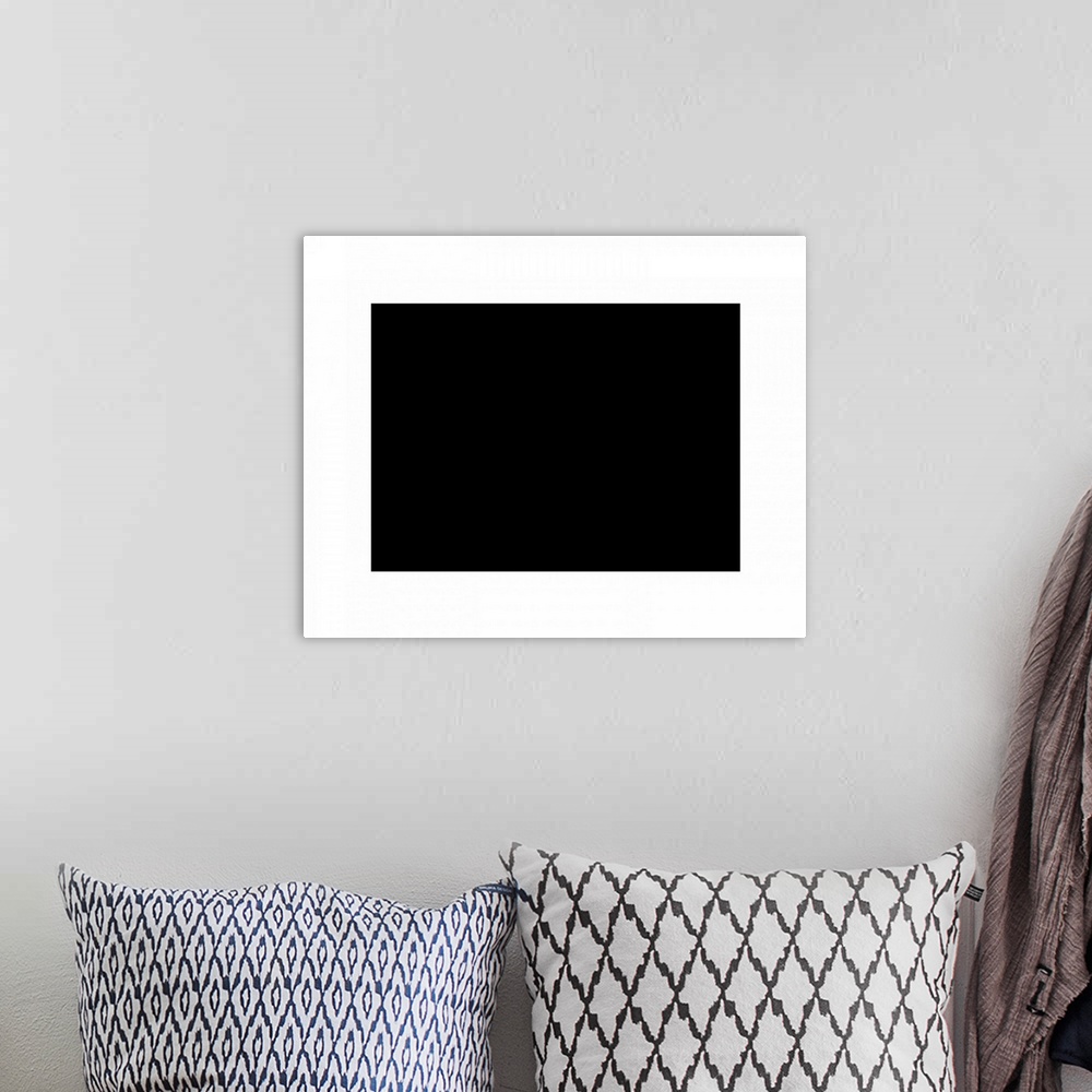 A bohemian room featuring Contemporary suprematist artwork of a black rectangle with a white border.