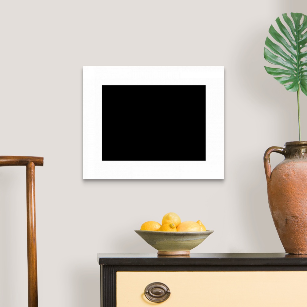 A traditional room featuring Contemporary suprematist artwork of a black rectangle with a white border.