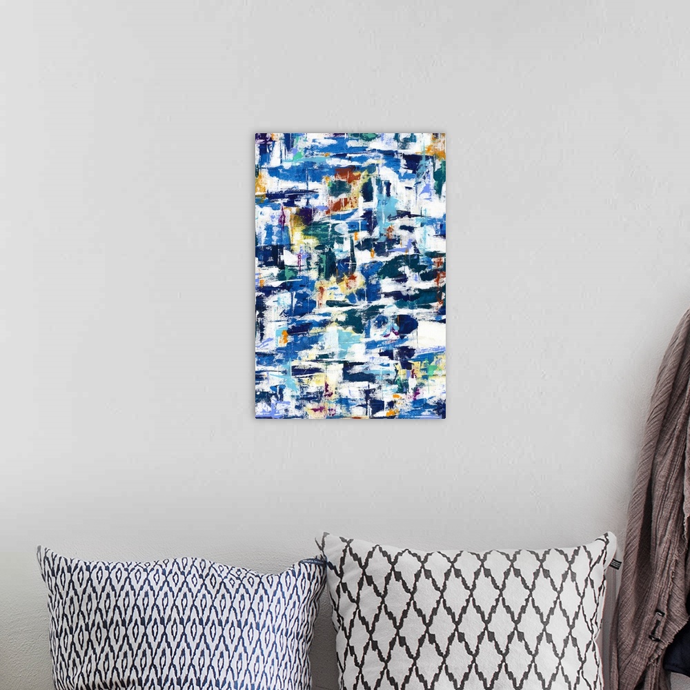 A bohemian room featuring Large abstract artwork with busy brushstrokes in shades of blue, yellow, orange, green, and red.