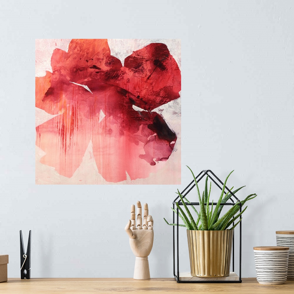 A bohemian room featuring Square abstract painting of a large tropical flower in shades of red.