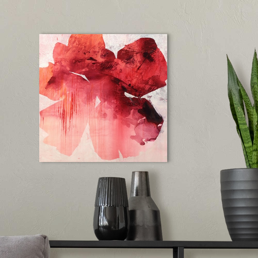 A modern room featuring Square abstract painting of a large tropical flower in shades of red.