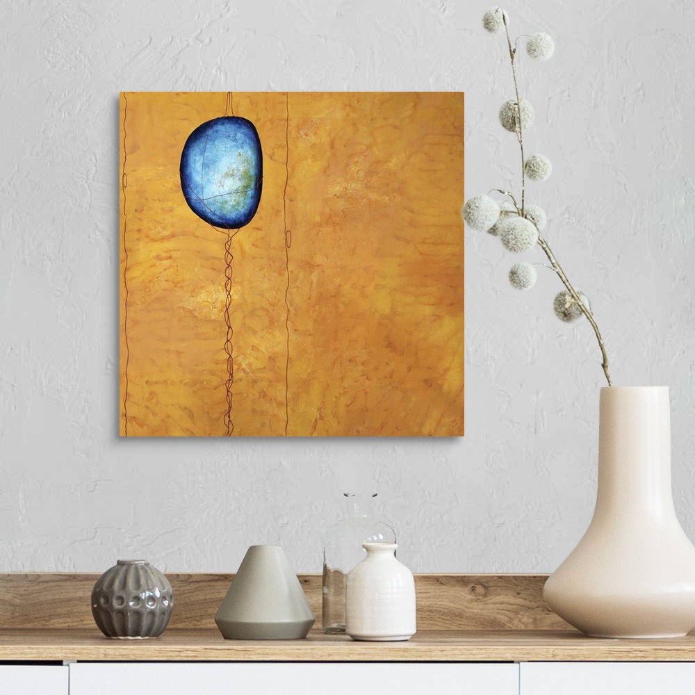 A farmhouse room featuring Square abstract art with a blue colored stone wrapped in thin lines that run from the top to the ...
