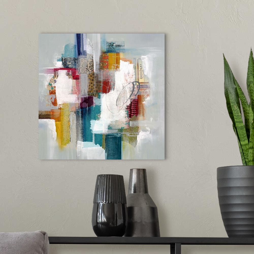 A modern room featuring Colorful abstract artwork with bright white spaces among red, blue, and yellow blocks.