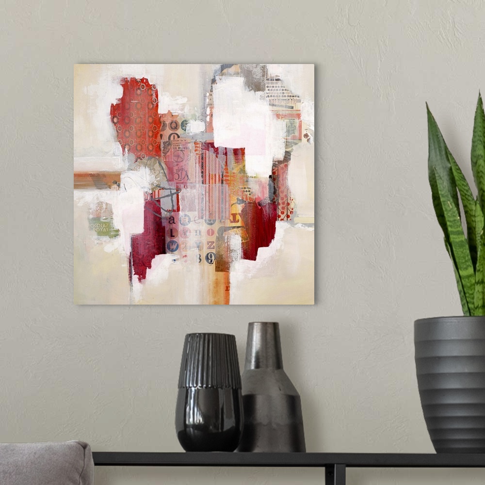 A modern room featuring Colorful abstract artwork with bright white spaces among red mixed media blocks.