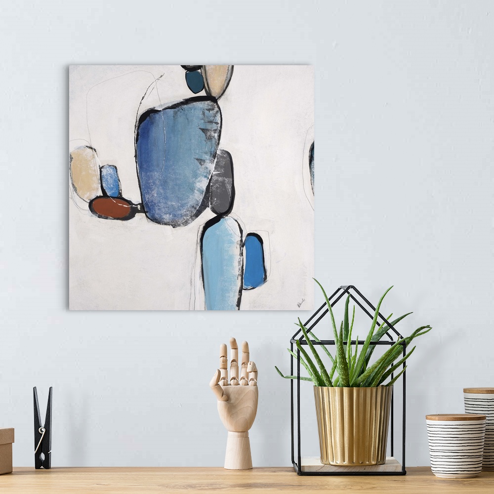 A bohemian room featuring Abstract painting of organic shapes in different colors, against a neutral background.