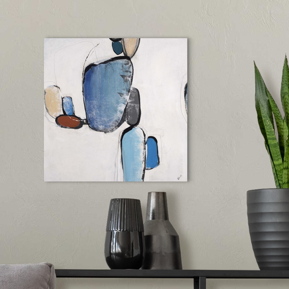 A modern room featuring Abstract painting of organic shapes in different colors, against a neutral background.