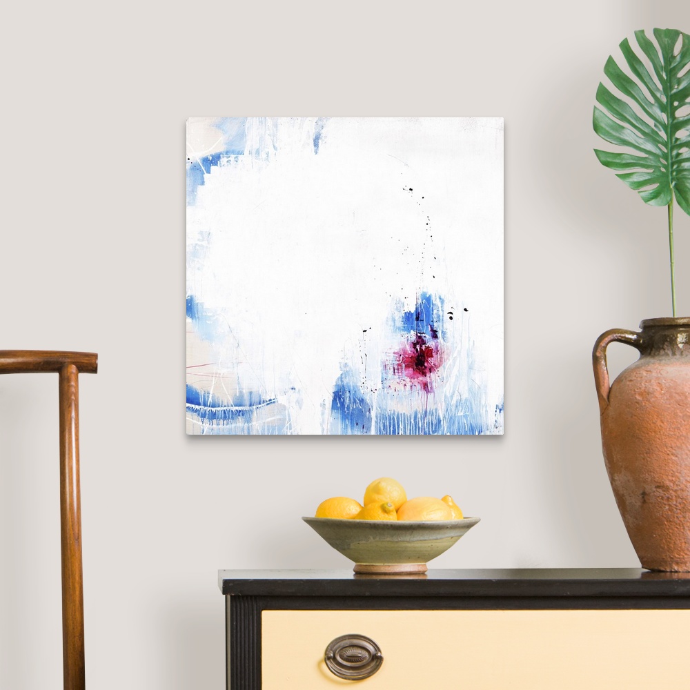 A traditional room featuring A contemporary abstract painting of a vibrant blue and red against a white background.