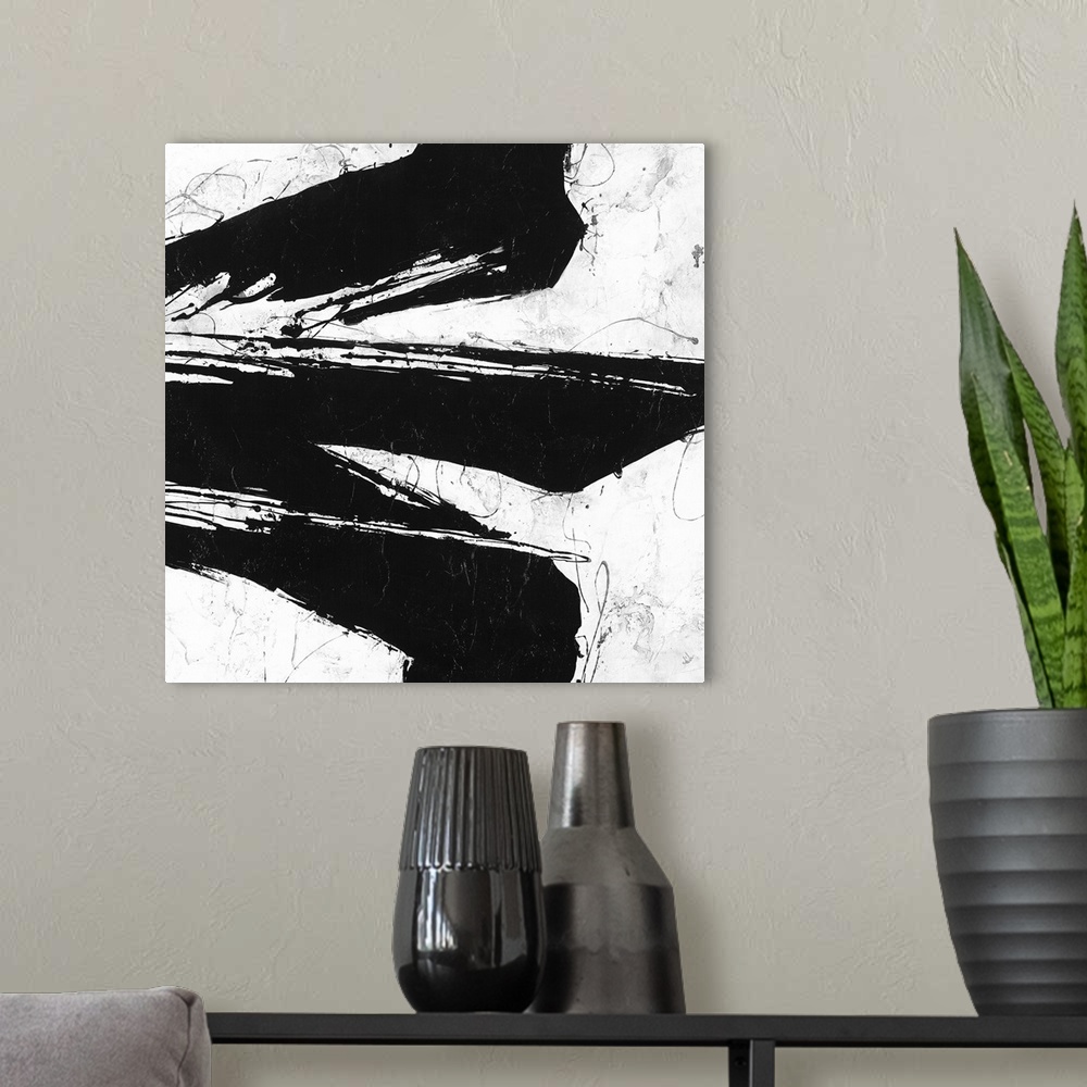 A modern room featuring Black and white abstract painting of black strokes of paint in wandering directions.