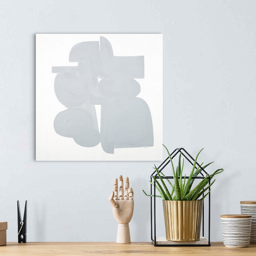 A bohemian room featuring Square art that has light gray shapes connecting on a white background with a minimalist feel.