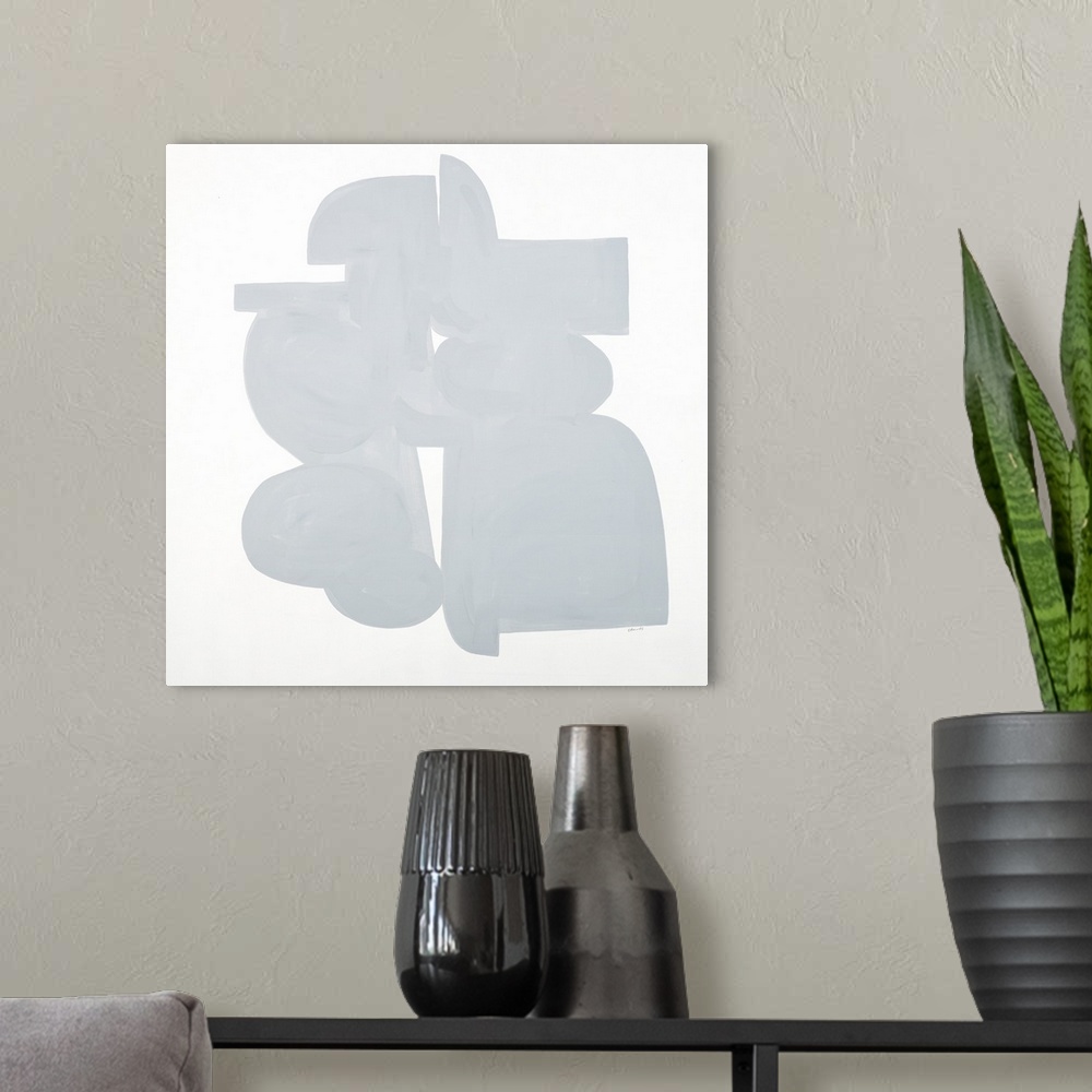 A modern room featuring Square art that has light gray shapes connecting on a white background with a minimalist feel.
