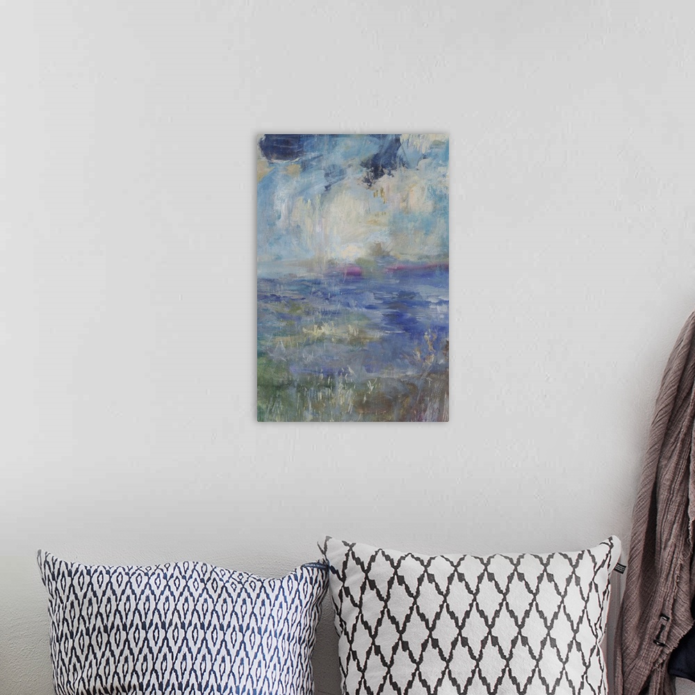 A bohemian room featuring Abstract contemporary artwork in shades of blue, resembling a seascape.