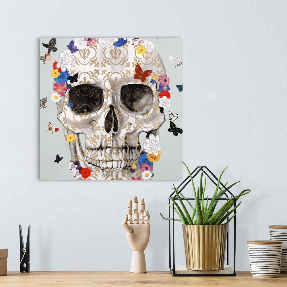 A bohemian room featuring Artwork of a patterned skull surrounded by small, colorful butterflies.