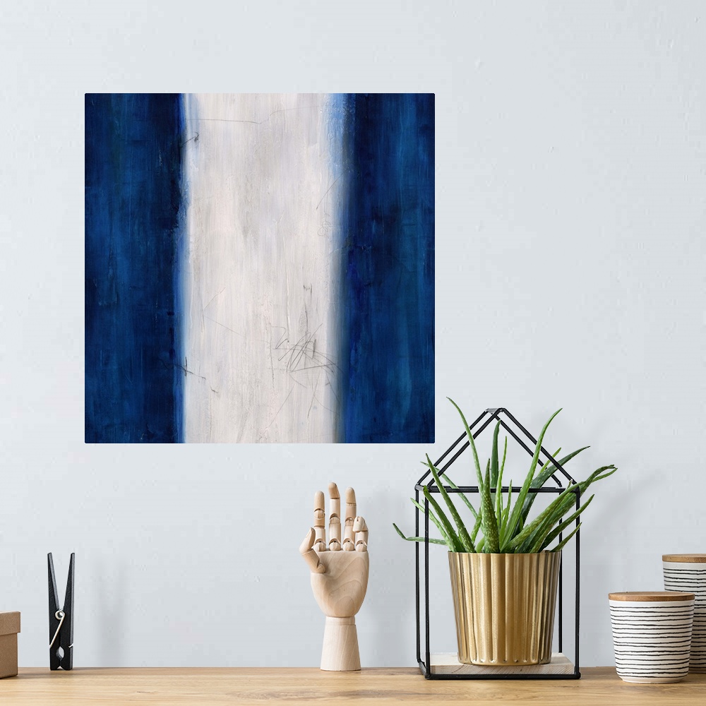 A bohemian room featuring Abstract painting using dark blue stripes on the left and right sides of the image, with a white ...