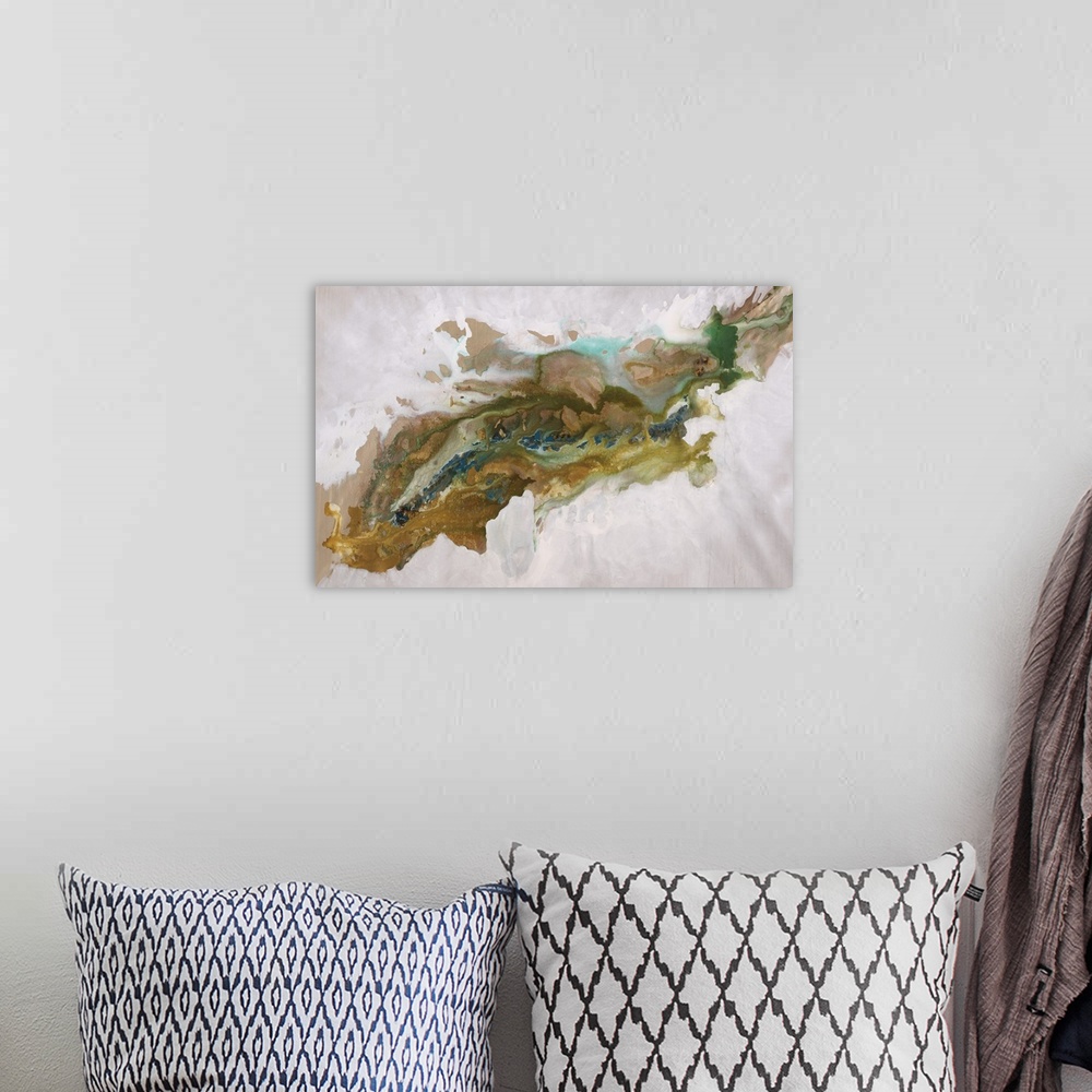A bohemian room featuring Abstract painting of an aerial view over a deep, rocky canyon that run diagonally through the image.