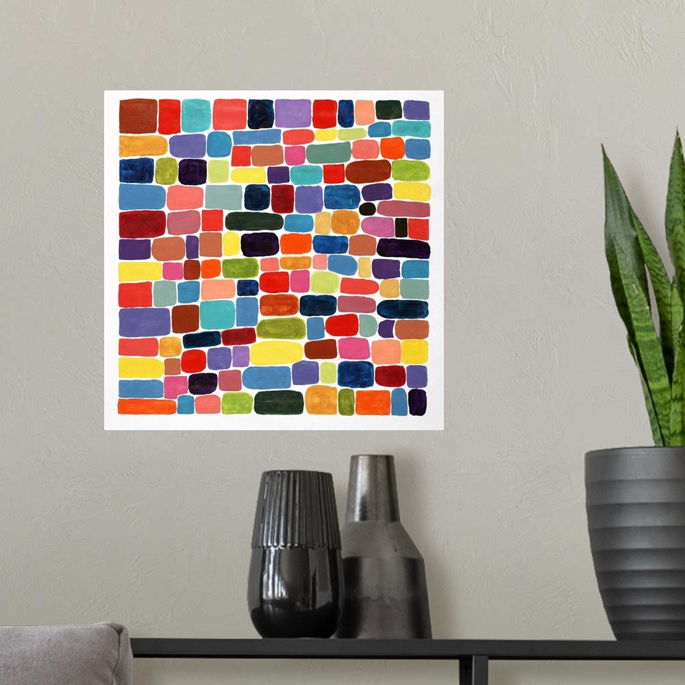 A modern room featuring Contemporary abstract painting of brightly colored shapes making a mosaic.