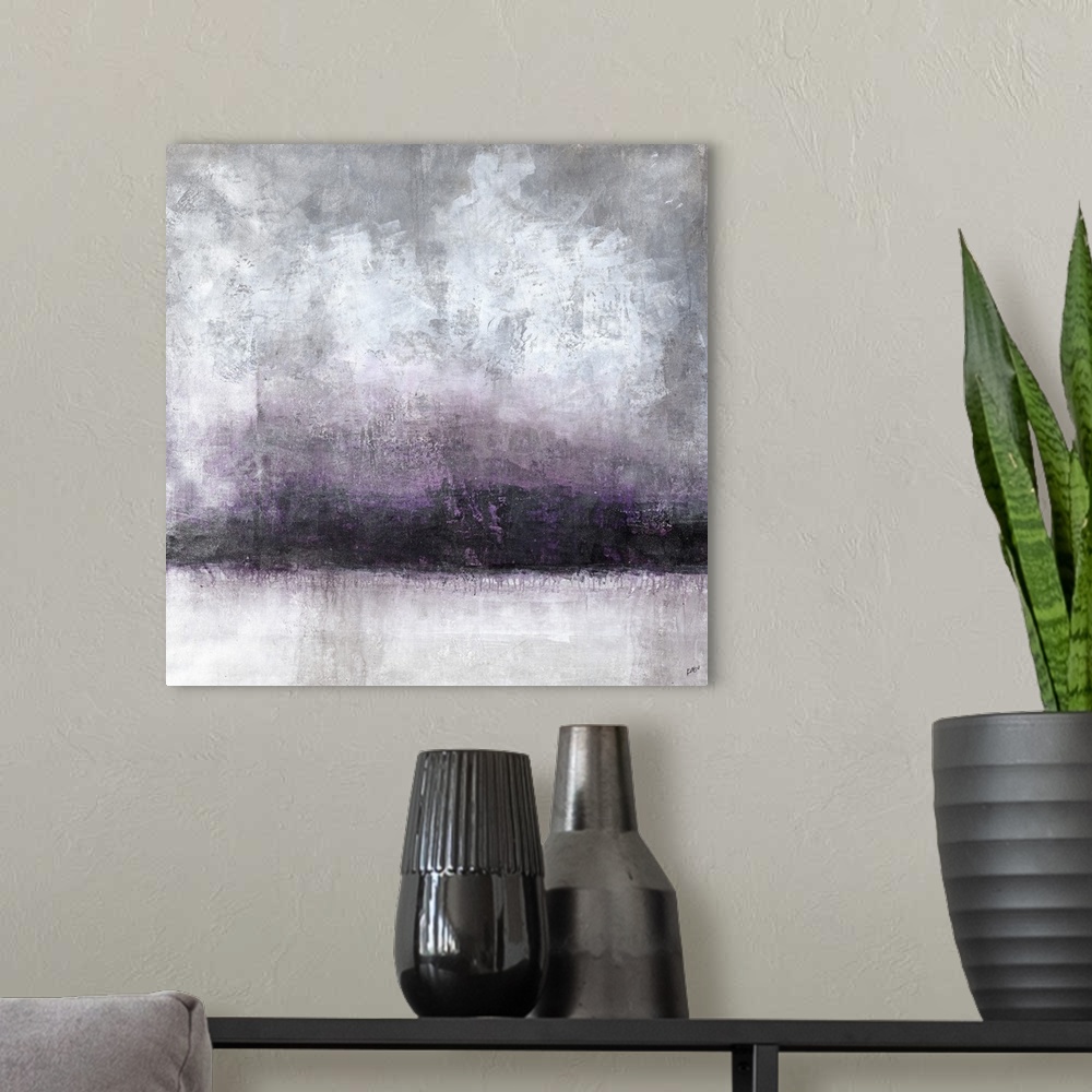 A modern room featuring A moody abstract landscape in shades of gray and purple.