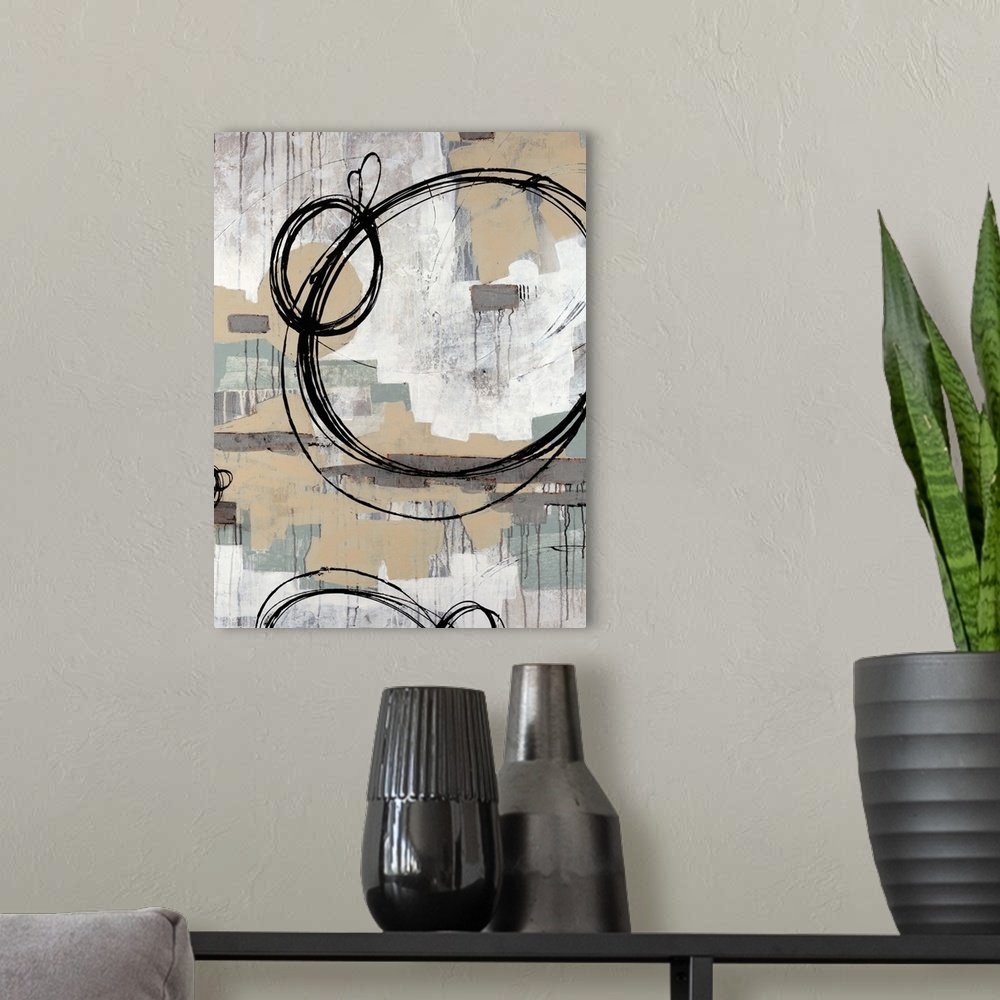 A modern room featuring Abstract painting with neutral colors in rectangle splotches in the background with dark ring cir...