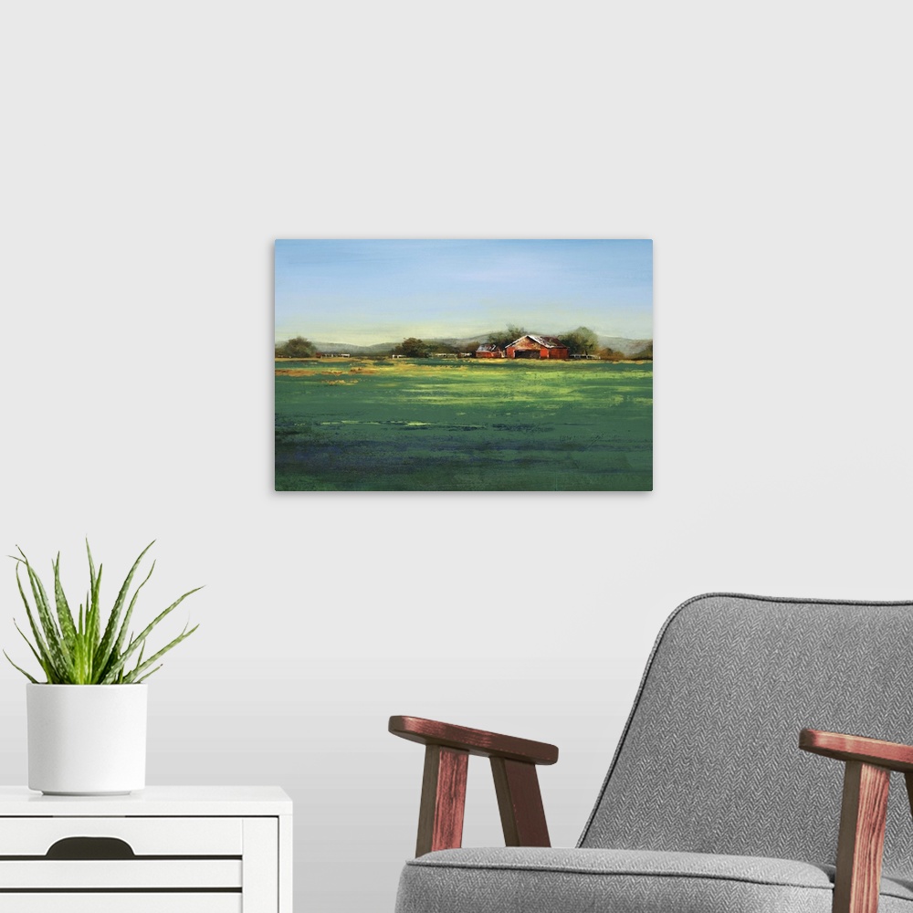 A modern room featuring Contemporary artwork of a farm landscape with a green field.
