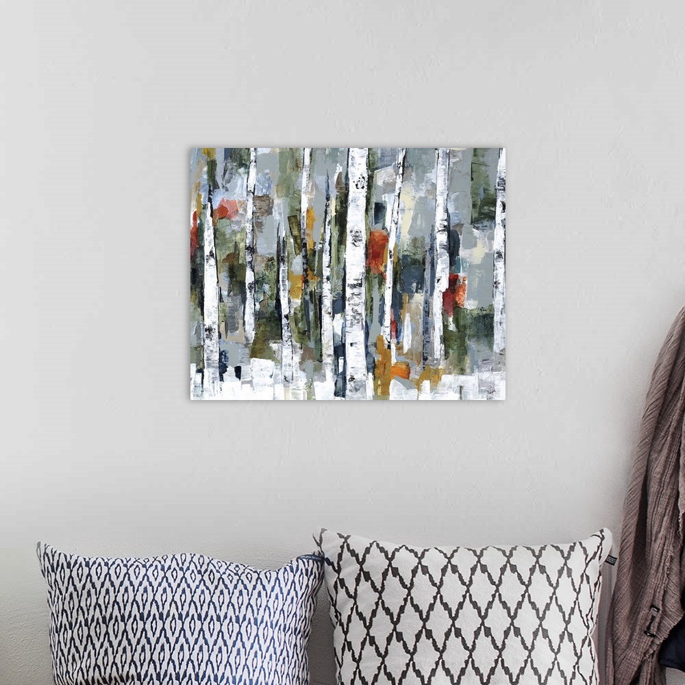 A bohemian room featuring Large abstract painting of a wooded forest of colorful fall leaves.