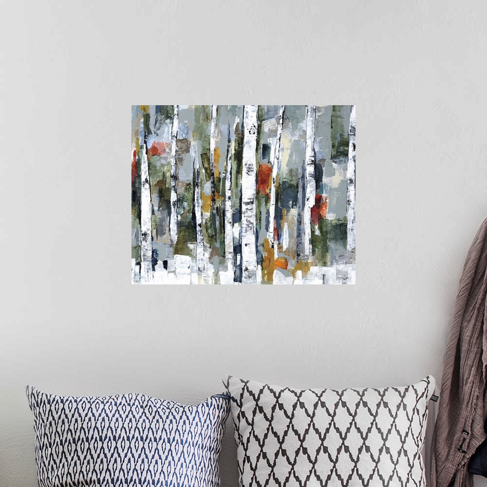 A bohemian room featuring Large abstract painting of a wooded forest of colorful fall leaves.